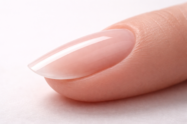 Side profile close-up of a single nail showing a perfectly structured builder gel overlay with a visible gentle arch