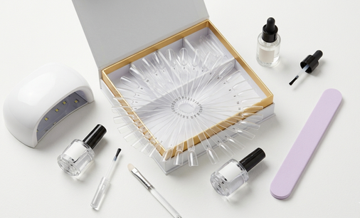 Overhead flat lay of an open Aprés-style nail kit 